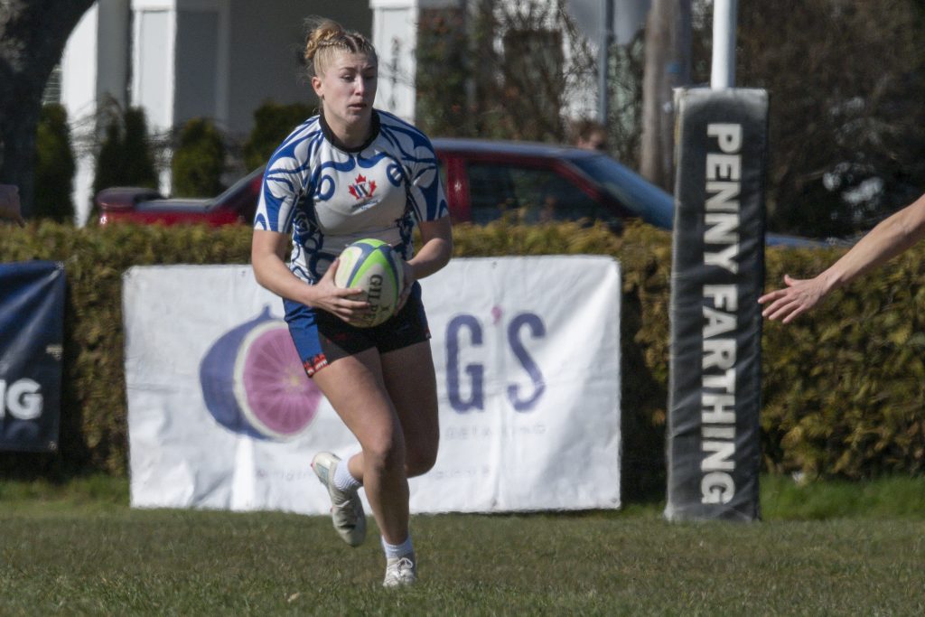 A Westshore Valkyrie kicking the ball in front of the sponsor boards, February 2026.