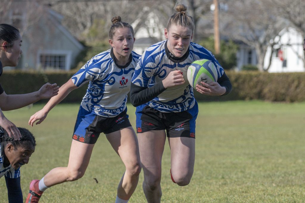 A Westshore Valkyrie running with the ball, a defender in pursuit, February 2026.