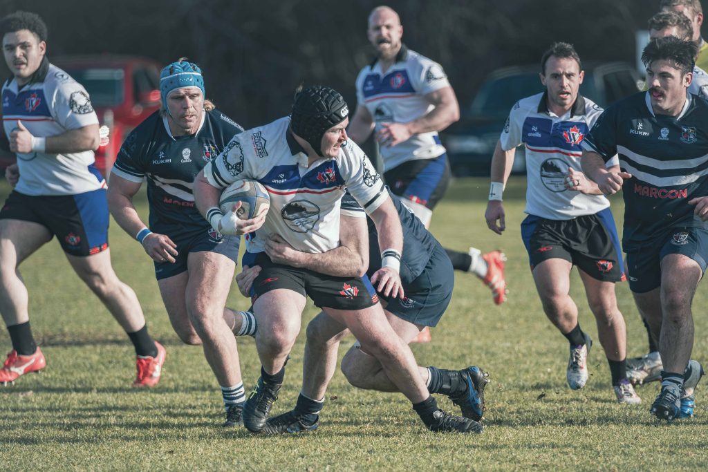 A Westshore forward carrying the ball into contact with teammates either side, home game, February 2026.